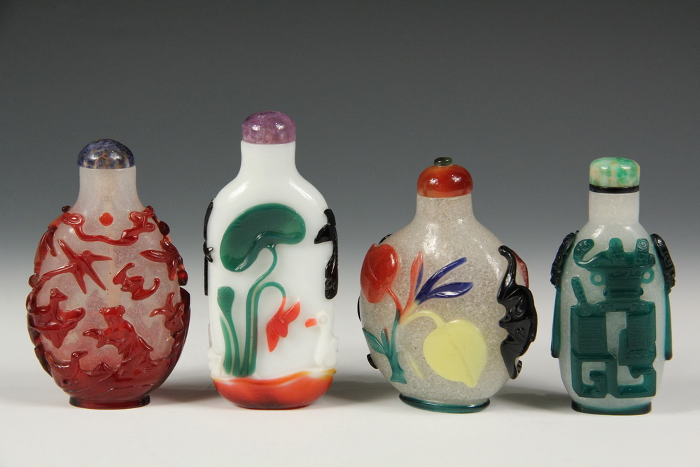 Appraisal: A GROUP OF OVERLAY GLASS SNUFF BOTTLES - Including A