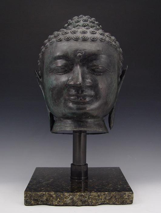 Appraisal: CAST BRONZE BUDDHA HEAD Finely detailed mounted on a black