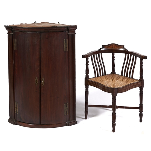 Appraisal: A George III bow fronted mahogany and crossbanded hanging corner