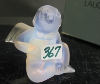 Appraisal: A LALIQUE FRANCE FROSTED AND OPALESCENT ANGEL the seated winged