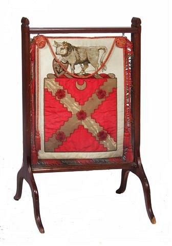 Appraisal: A RECTANGULAR MAHOGANY FIRE SCREEN containing a silk work crest