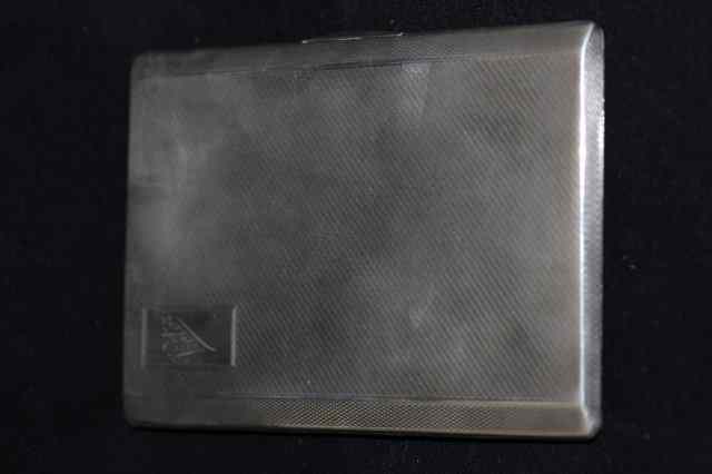 Appraisal: A SILVER CIGARETTE CASE with engine turned decoration bearing marks