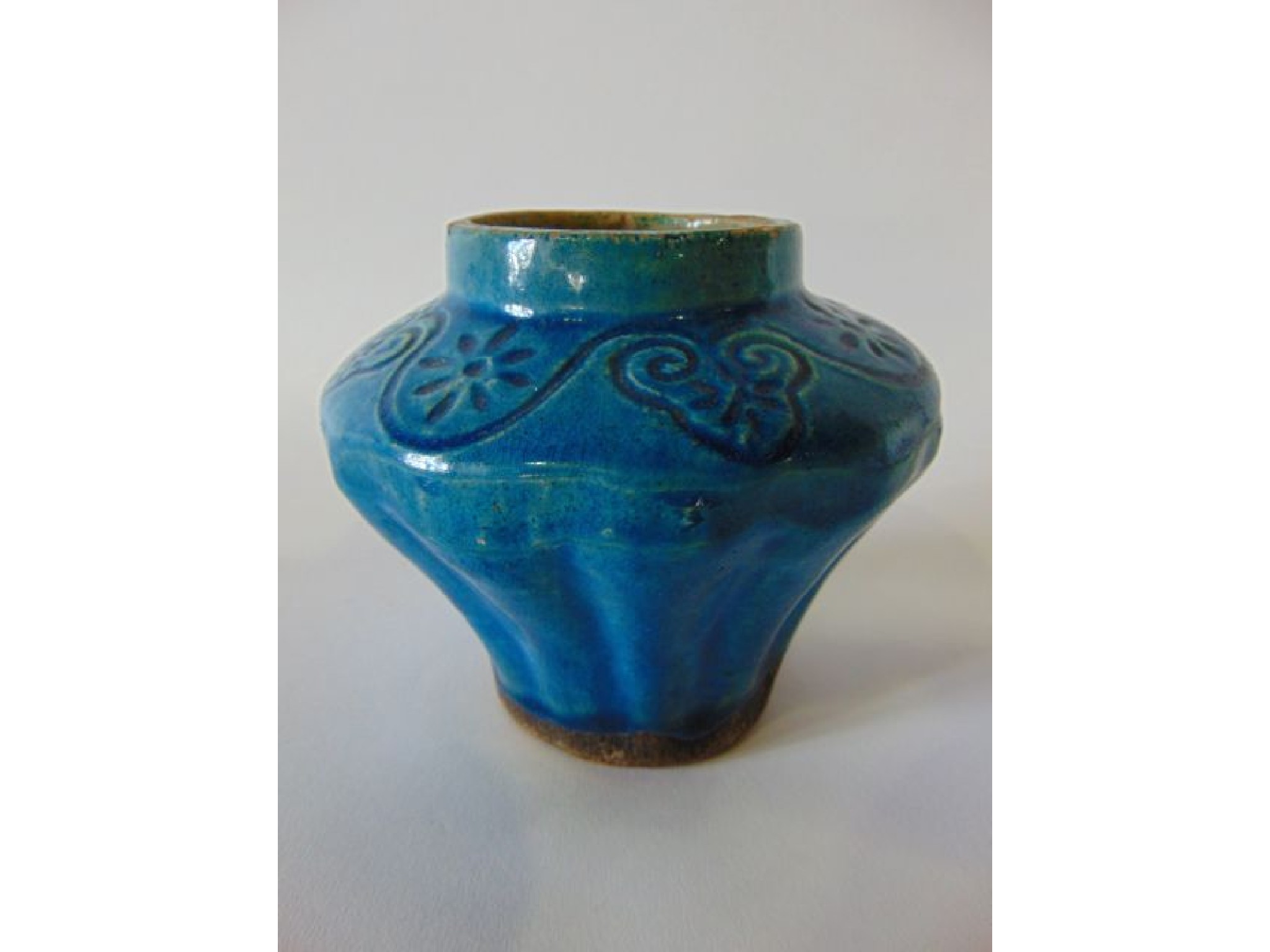 Appraisal: A th century turquoise glazed vase of fluted form with