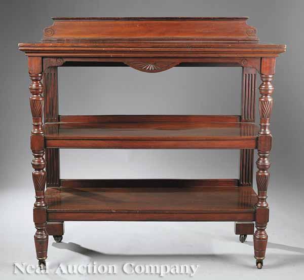 Appraisal: A Victorian Carved Mahogany Trolley late th c with scrolled