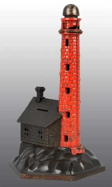 Appraisal: Cast Iron Lighthouse Mechanical Bank Description Working All original Condition