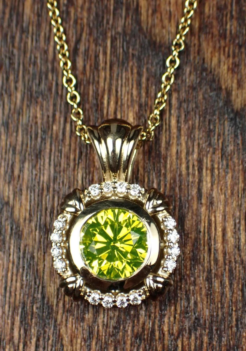 Appraisal: GIA CERTIFIED YELLOW-GREEN DIAMOND NECKLACE with a k yellow gold