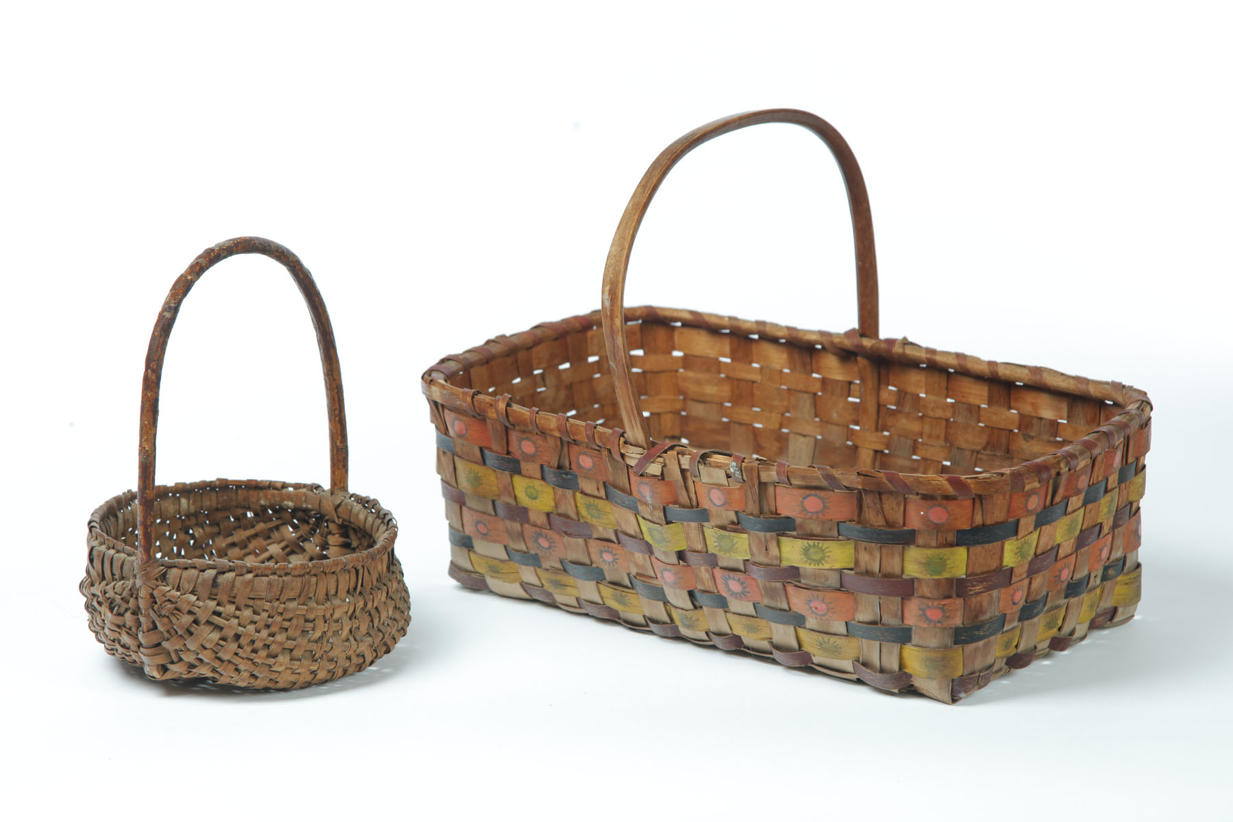 Appraisal: TWO BASKETS American nd half- th century woven splint Gathering