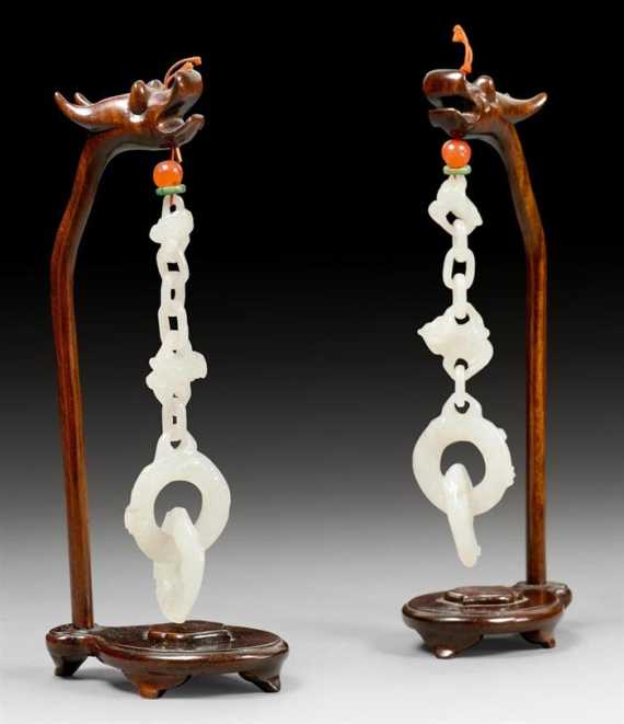 Appraisal: A PAIR OF WHITE JADE CHAINS WITH CARVED RINGS China