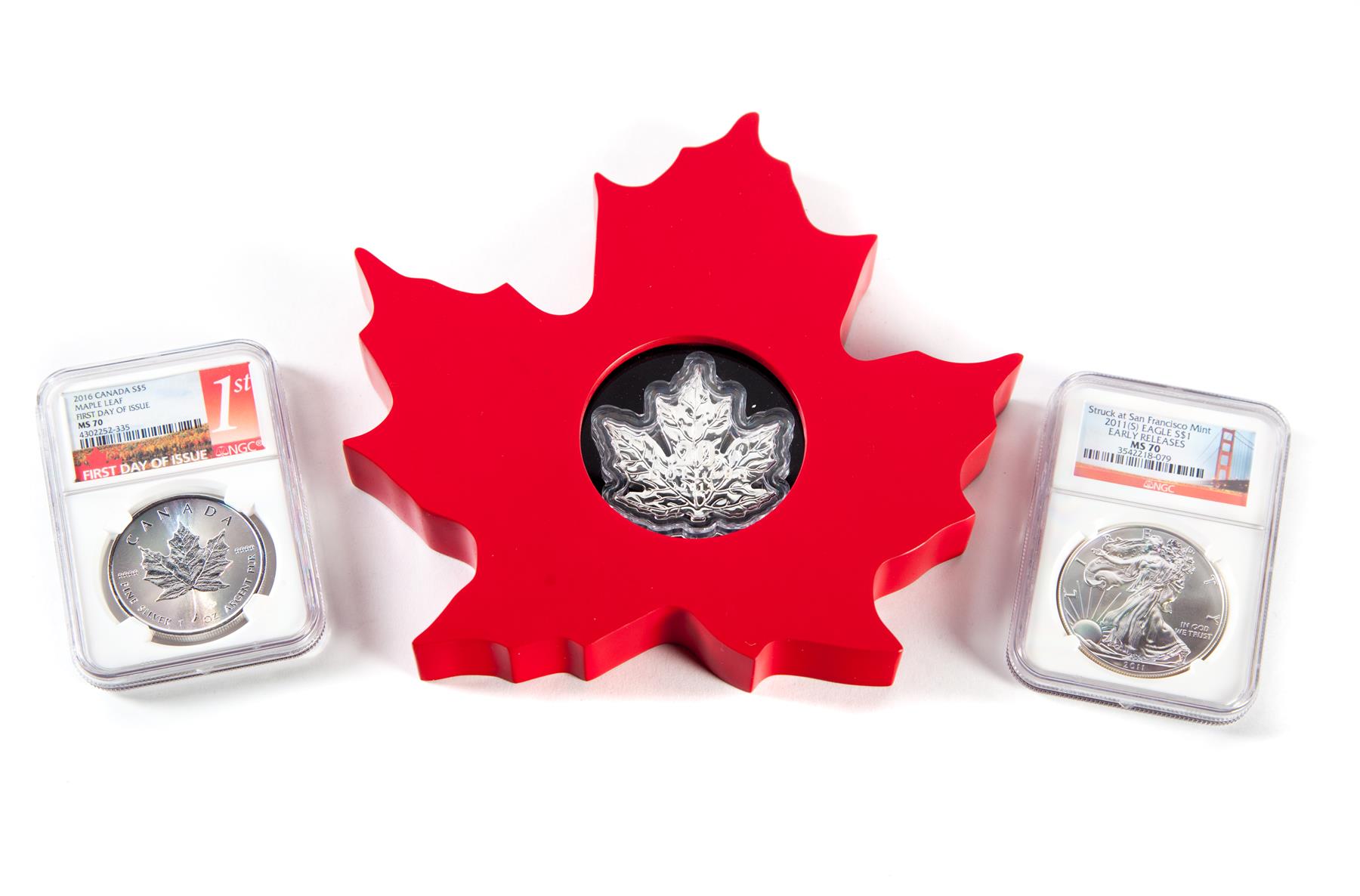 Appraisal: THREE SILVER COINS Canadian silver maple leaf-shaped Canada maple leaf