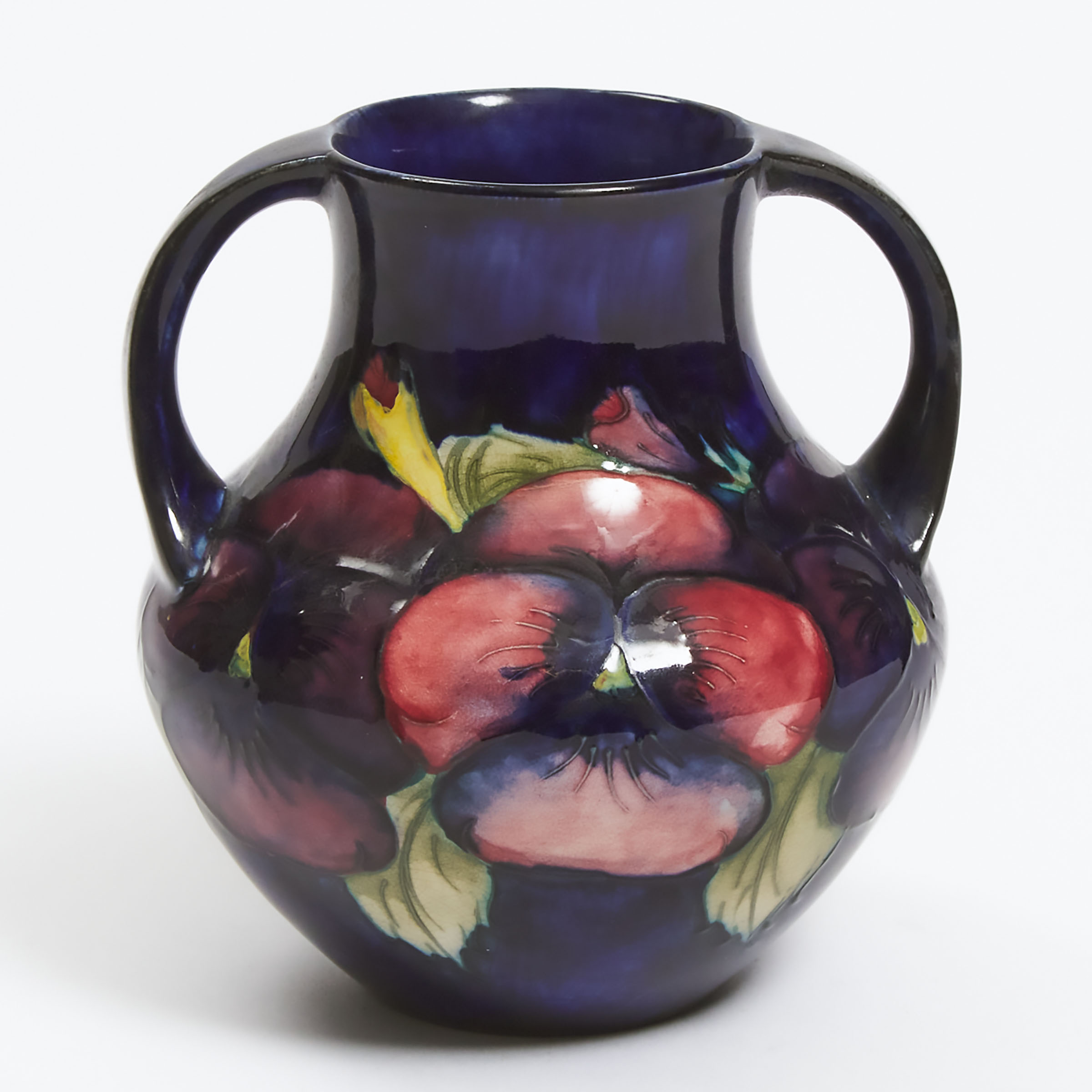 Appraisal: Moorcroft Two-Handled Pansy Vase c height in cm