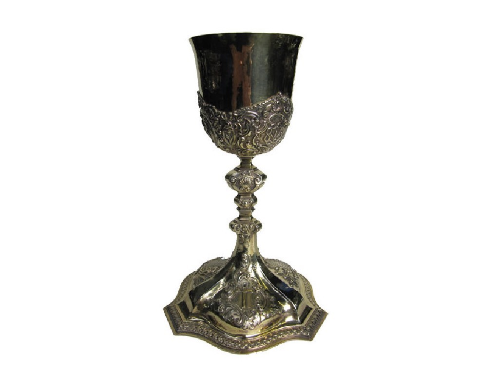 Appraisal: A silver gilt communion chalice the hammered bowl chased with