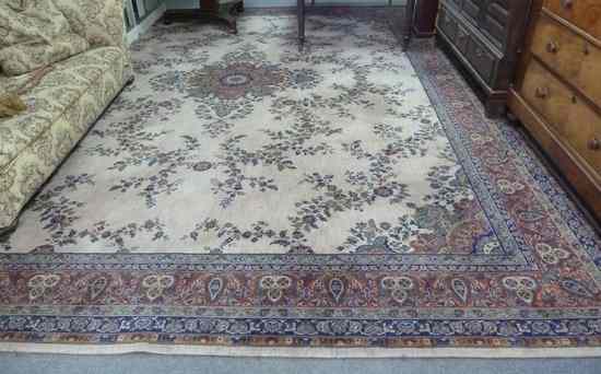 Appraisal: A large Kashan style carpet the central medallion surrounded by