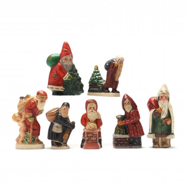 Appraisal: SELECTION OF SEVEN VAILLANCOURT SANTA FIGURES CARRYING SACKS All signed