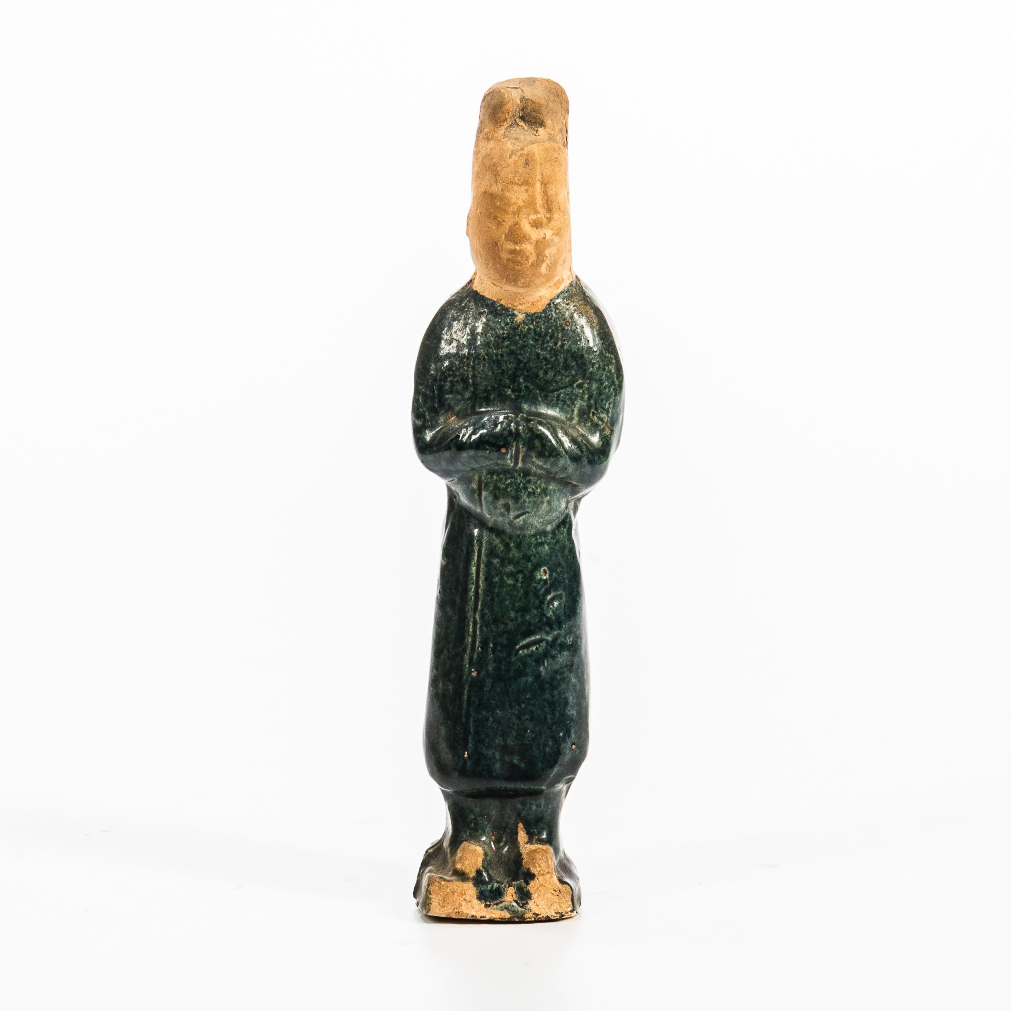 Appraisal: POTTERY GREEN-GLAZED STANDING FIGURE China Tang dynasty-style dressed in an