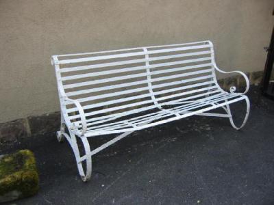 Appraisal: A VICTORIAN WROUGHT IRON STRAPWORK BENCH with scroll back top