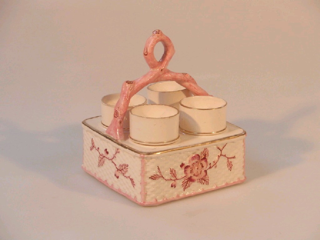 Appraisal: A Victorian cream ware pottery egg cruet with pink and