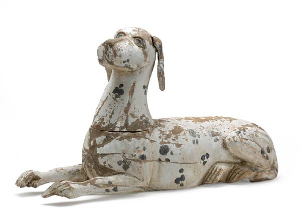 Appraisal: A Folk Art carved and painted wood figure of dog