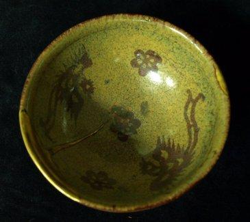 Appraisal: A Sung Kian ware porcellanous tea bowl decorated a Phoenix