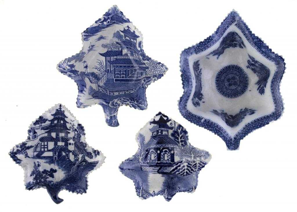 Appraisal: FOUR BLUE PRINTED EARTHENWARE AND PEARLWARE PICKLE DISHES of vine