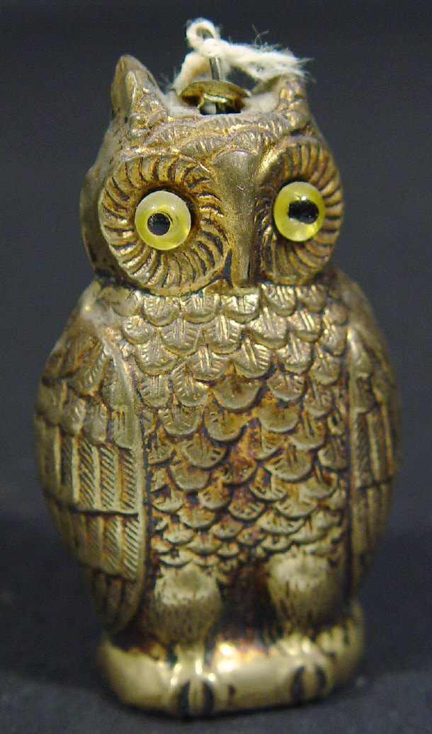 Appraisal: Novelty brass owl shaped sewing tape measure with glass eyes