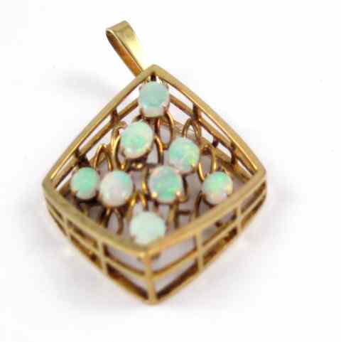 Appraisal: OPAL AND FOURTEEN KARAT GOLD PENDANT the large pendant is