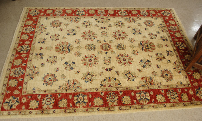 Appraisal: HAND KNOTTED ORIENTAL AREA RUG Pakistani-Persian floral arabesque design on