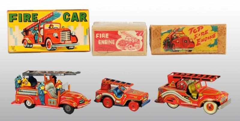 Appraisal: Lot of Tin Fire Engine Friction Toys Description Japanese Working