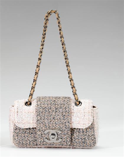 Appraisal: Chanel tweed pochette In classic Chanel suiting material in grays