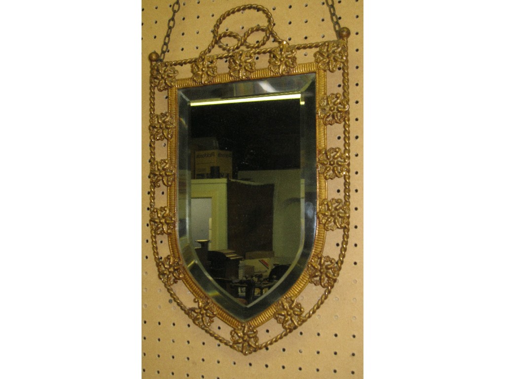 Appraisal: Gilt metal framed shield shaped wall mirror