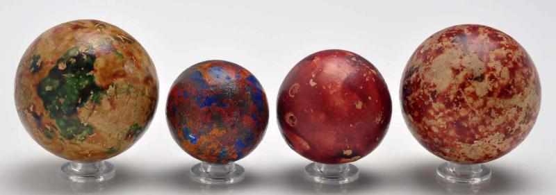 Appraisal: Lot of Large Clay Marbles Description The smaller marble is