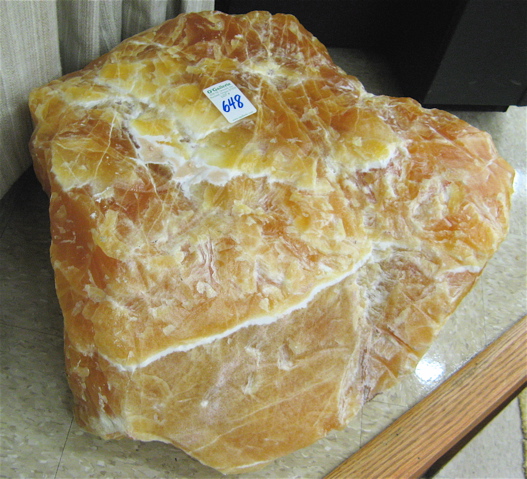 Appraisal: LARGE ORANGE CALCITE BOULDER a natural rough calcite stone measuring