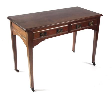 Appraisal: An Edwardian mahogany side table the rounded rectangular top above