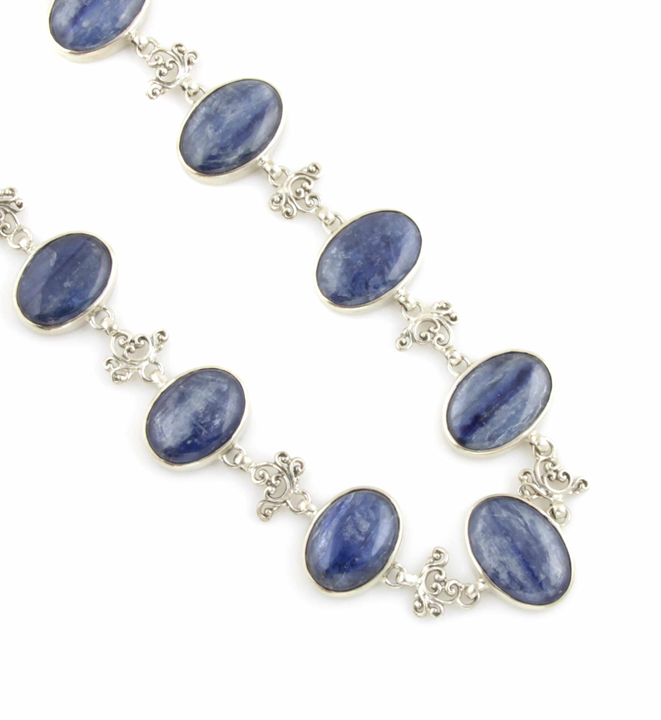 Appraisal: Kyanite and Silver Necklace Consisting of eleven oval cabochon kyanites