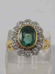 Appraisal: A diamond and emerald cluster ring set in an ct