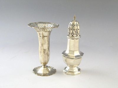 Appraisal: An Edwardian silver flower vase panelled tapering form pierced scroll