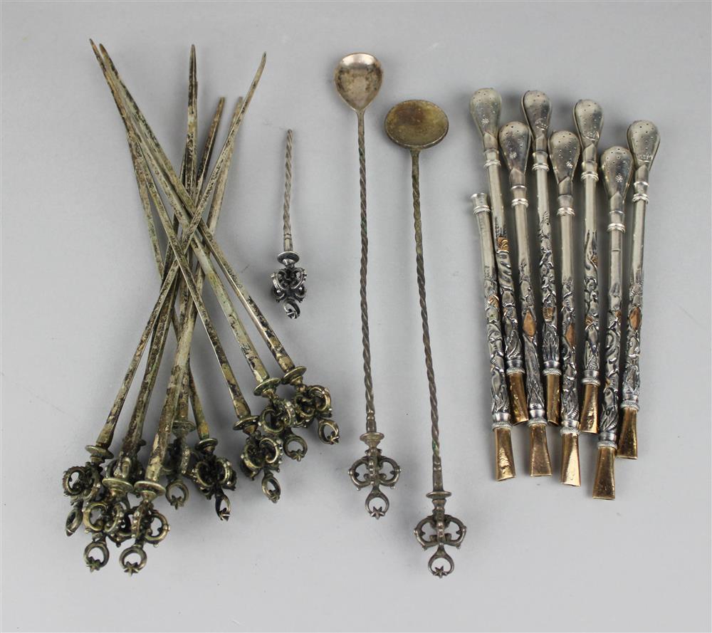 Appraisal: SEVEN ARGENTINE GOLD-MOUNTED SILVER MATE SPOONS of typical shape with