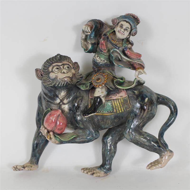 Appraisal: Glazed tilework Chinese figure group deity riding monkey with peach