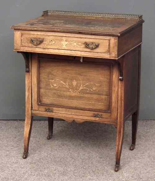 Appraisal: A late Victorian inlaid rosewood Davenport with brass gallery to