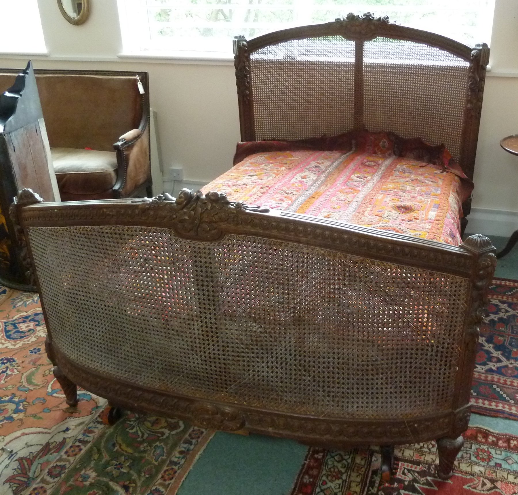 Appraisal: A French Louis XV style berg re bed the frames