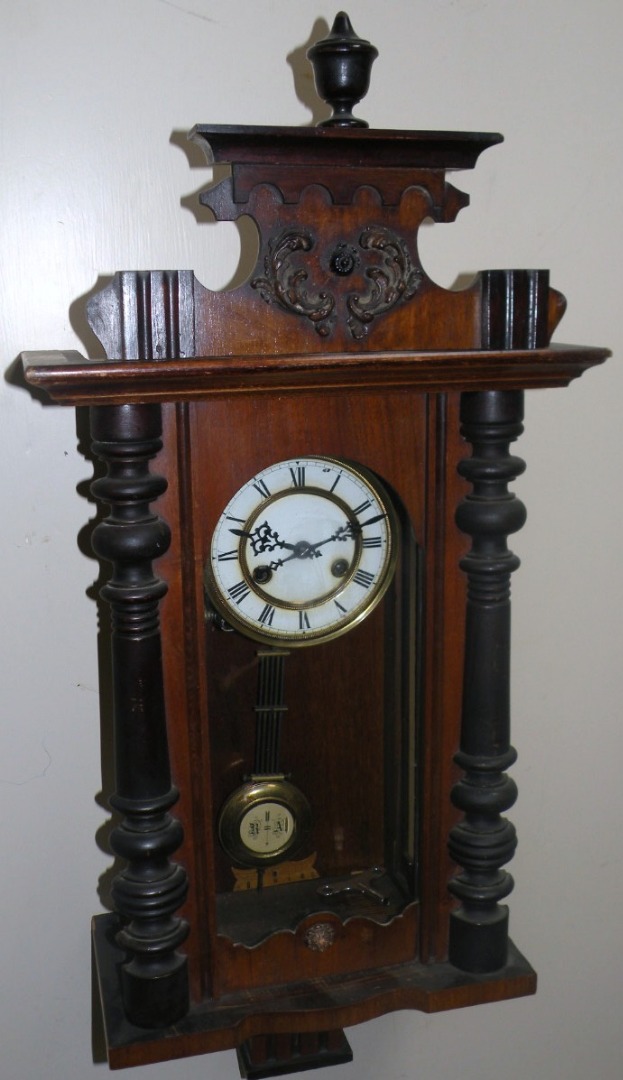 Appraisal: An early thC walnut and part ebonised Vienna wall clock