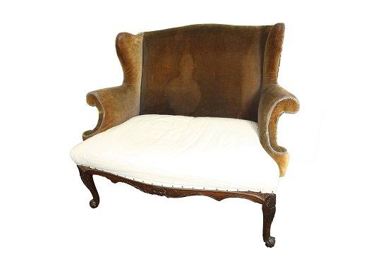 Appraisal: A late th Century style wing back sofa with scroll