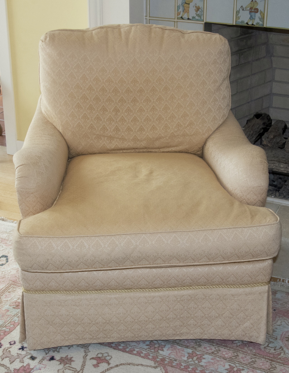 Appraisal: CREAM COLORED ARM CHAIR A large lounge armchair manufactured by