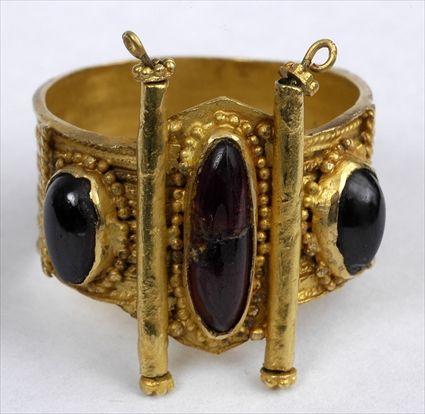 Appraisal: EARLY PERSIAN GARNET AND GOLD RING Size Provenance Property from