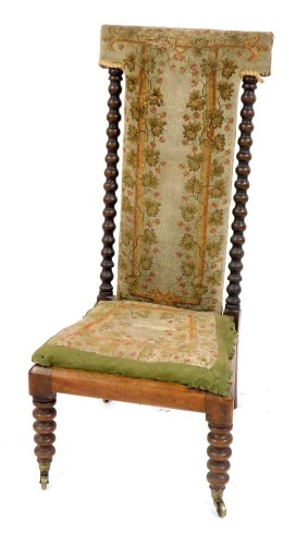 Appraisal: A Victorian walnut prie dieu chair with a shaped back