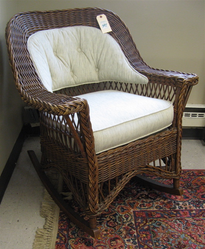 Appraisal: WICKER ROCKER AND LAMP TABLE American th century The brown