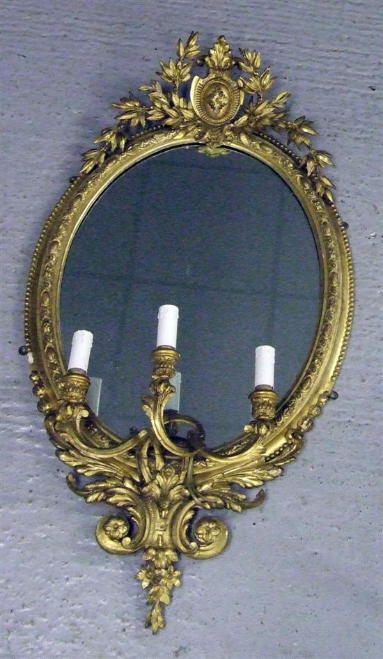 Appraisal: th century oval gesso gilt framed girandole with foliage and