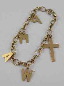 Appraisal: A yellow metal tests ct gold charm bracelet with five