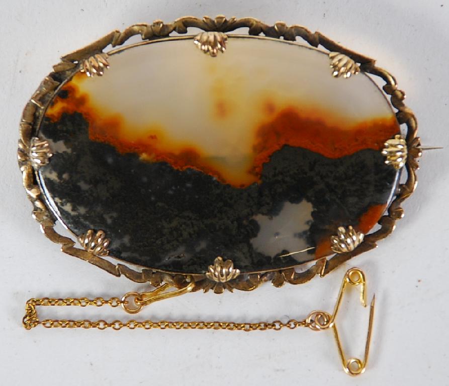 Appraisal: VICTORIAN LARGE OVAL BROOCH in gold coloured scroll frame wide