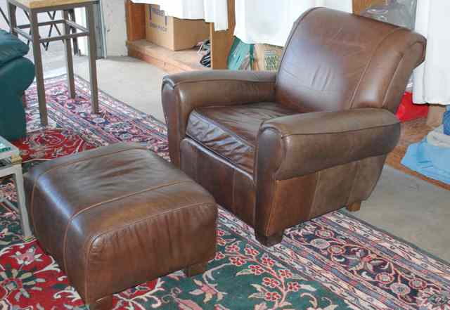 Appraisal: CONTEMPORARY BROWN LEATHER EASY CHAIR AND MATCHING OTTOMAN