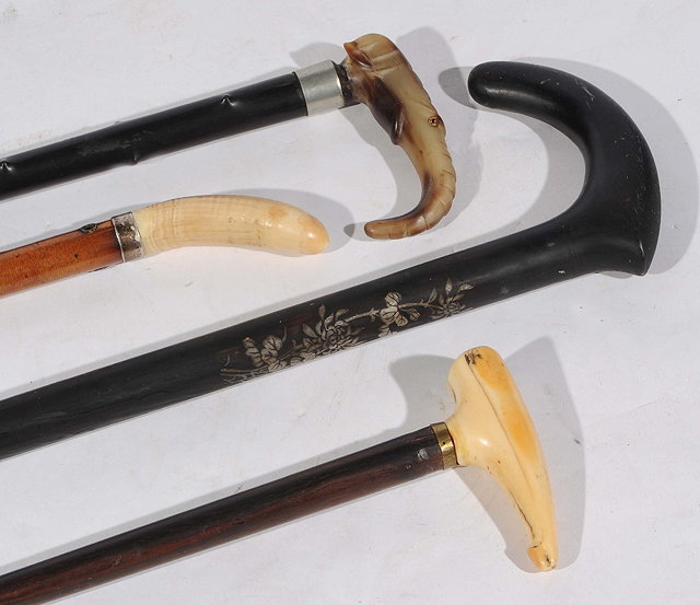 Appraisal: A CHINESE MOTHER-OF-PEARL INLAID BLACK WOOD WALKING STICK and three